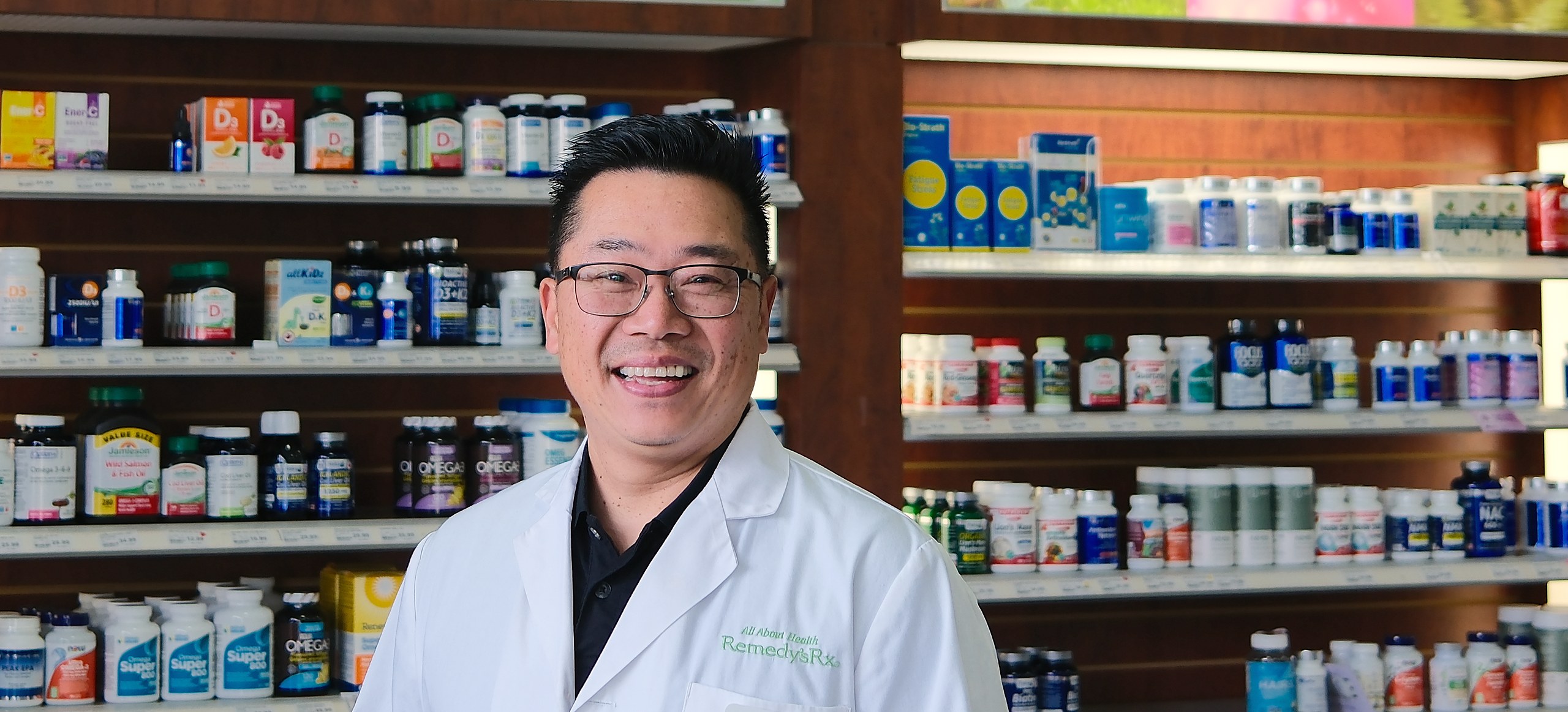Lee Tuan, pharmacist and owner, in the supplement aisle at All About Health Remedy'sRx